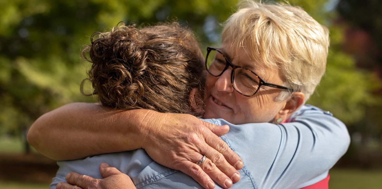 Helping in is in Kate Williams' (right) DNA. A second-generation nurse — her mum and four aunts are all in the profession. Here she's hugging Mel Small, one of her first patients as a McGrath Breast Care Nurse in regional South Australia.