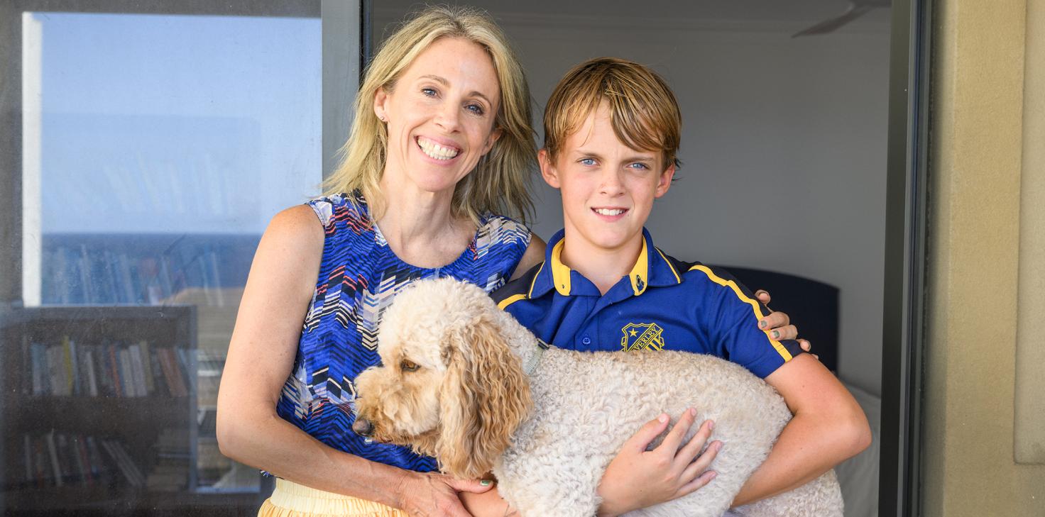 Sophie at home with her son and their dog